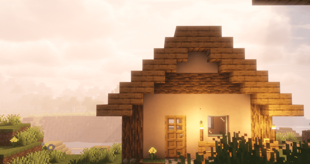 A cozy Minecraft house illuminated by warm lighting from Solas Shaders, creating a soft and atmospheric glow. The wooden textures appear rich and detailed, while the ambient lighting enhances the depth of the scene. The background features a hazy, golden sky with volumetric clouds, adding to the serene and immersive feel.