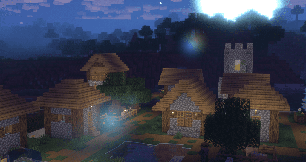 A peaceful Minecraft village at night, enhanced with Super Duper Vanilla Shaders. The bright moonlight casts a soft glow over the landscape, creating realistic lighting and shadows. The warm illumination from lanterns and windows adds depth to the scene, while the subtle reflections in the water enhance the immersive atmosphere. A slight lens flare effect highlights the shader’s attention to realistic lighting.