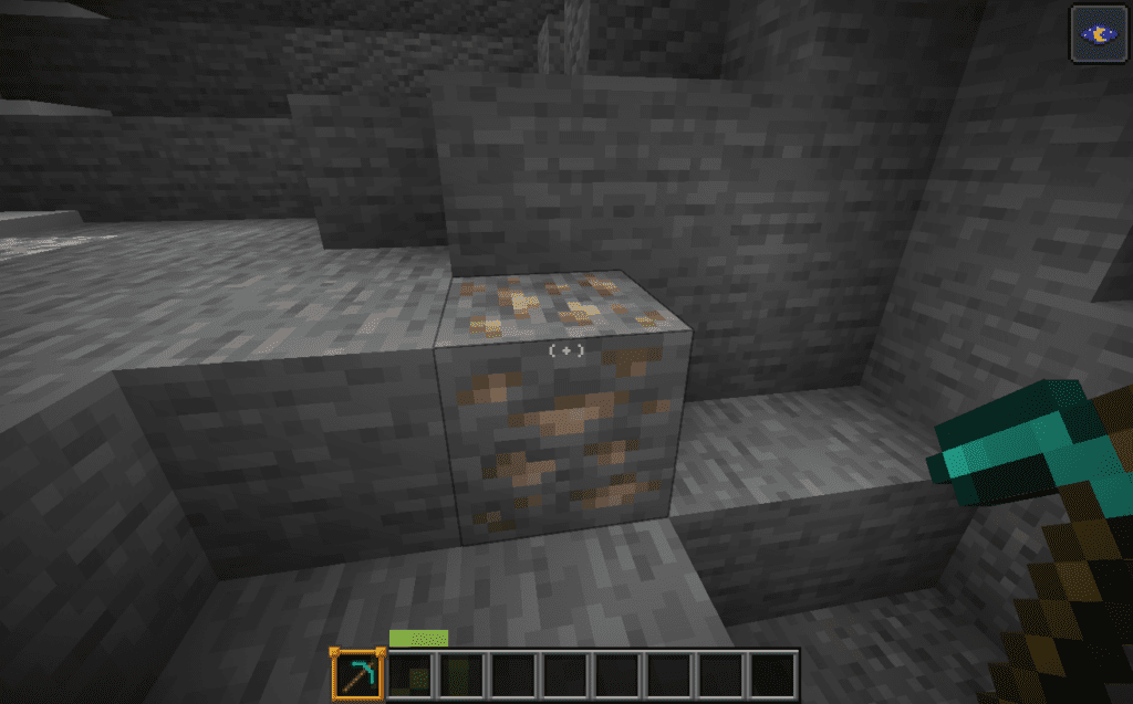 Player aiming at iron ore block in Minecraft with pickaxe before using Veinminer