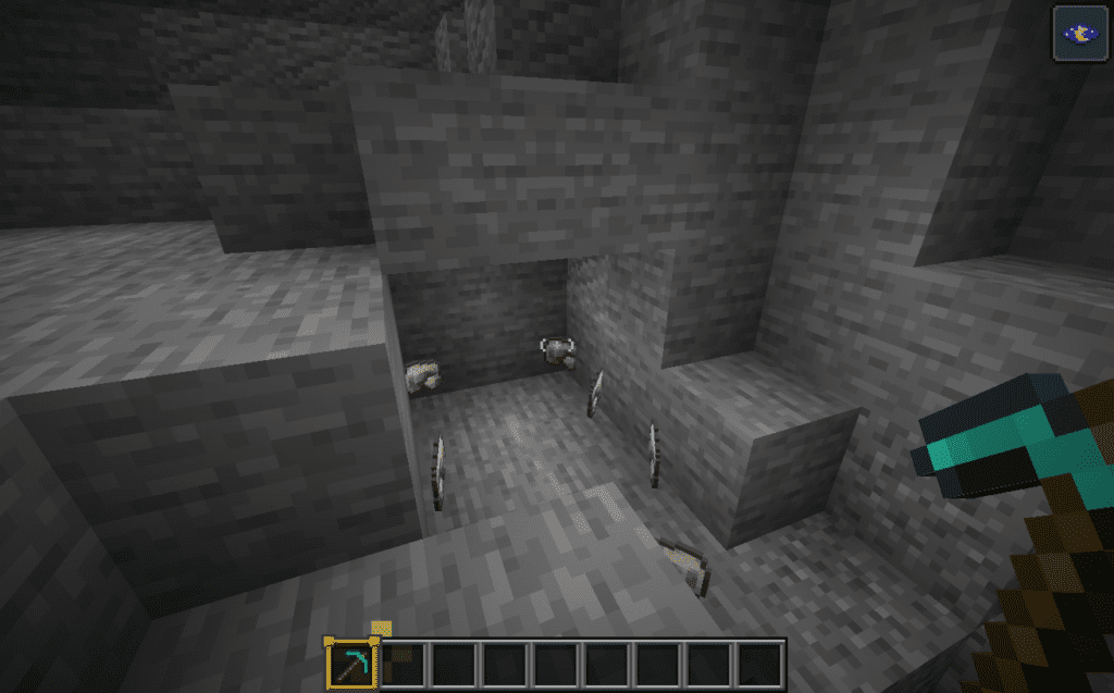 Dropped items after breaking iron ore vein with Veinminer mod in Minecraft