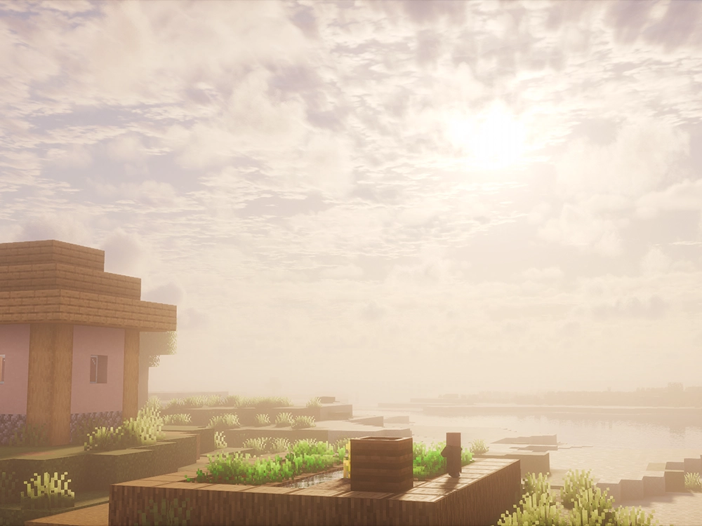 Photon Shaders Minecraft sunrise with soft cloud lighting and foggy village atmosphere